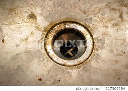 Dirty drain in the bathroom, cleaning service concept, old rusty shower drain Dirty drain in the bathroom, cleaning service concept, old rusty shower drain 117306264