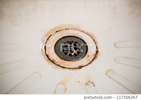 Dirty drain in the bathroom, cleaning service concept, old rusty shower drain Dirty drain in the bathroom, cleaning service concept, old rusty shower drain 117306267