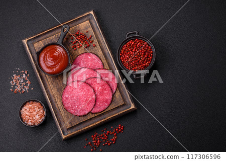 Delicious smoked salami sausage sliced with salt, spices and herbs 117306596
