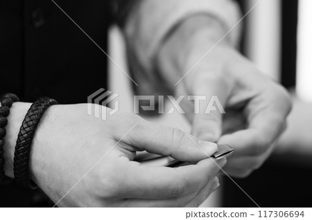 Changing blade in a dangerous razor in a barbershop 117306694