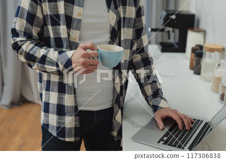 Businessman working at home on paperwork.  117306838