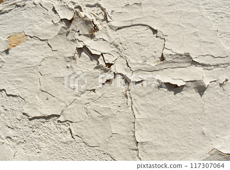 white peeling paint wall background, texture of a concrete old wall with stains and cracks white peeling paint wall background, texture of a concrete old wall with stains and cracks 117307064