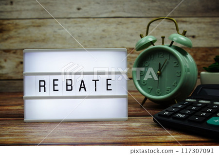 REBATE letterboard text on LED Lightbox on wooden background, business and promotion concept background 117307091
