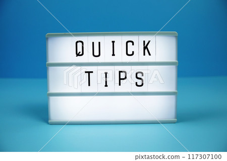 Quick Tips letterboard text on LED Lightbox on blue background Quick Tips letterboard text on LED Lightbox on blue background 117307100