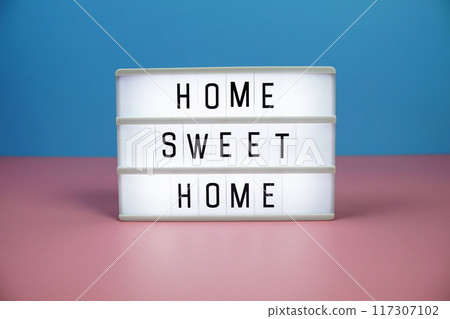 Home Sweet Home letterboard text on LED Lightbox on pink and blue background Home Sweet Home letterboard text on LED Lightbox on pink and blue background 117307102