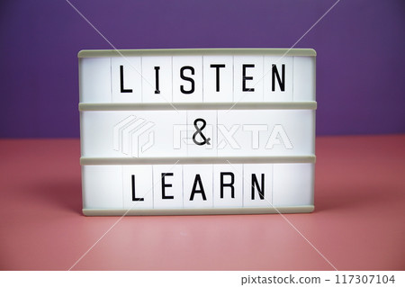 Listen & Learn letterboard text on LED Lightbox on pink and purple background 117307104