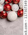 Red and white Christmas baubles border flat lay. Merry Christmas and Happy New Year seasons greetings card. Copy space. Festive border 117307349