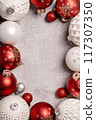 Red and white Christmas baubles frame flat lay. Merry Christmas and Happy New Year seasons greetings card. Copy space. Festive border 117307350