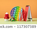 Group of colored stationery. rocket pencils on yellow background with rocket. Brain teaser and development for back to school or education. Bright accessories. Success achievement ideas 117307389