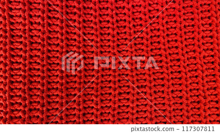 Red knitted wool fabric texture as background 117307811