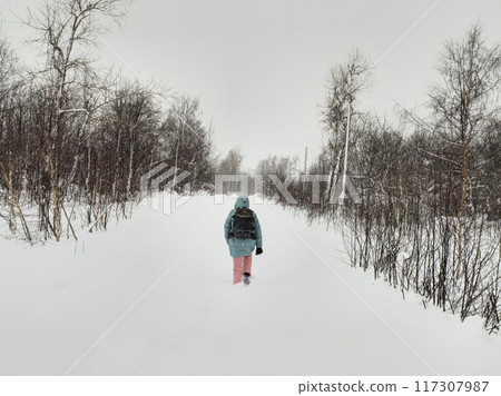 Walking through the winter forest in deep snow. The hard way. Walking through the winter forest in deep snow. The hard way. 117307987