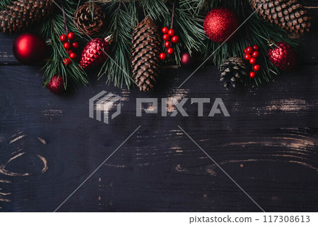 Christmass background red christmas tree toys and spruce brance on wooden background. 117308613