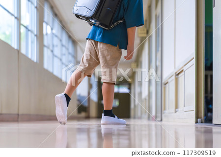 Elementary school students walking in the hallway Elementary school students walking in the hallway 117309519