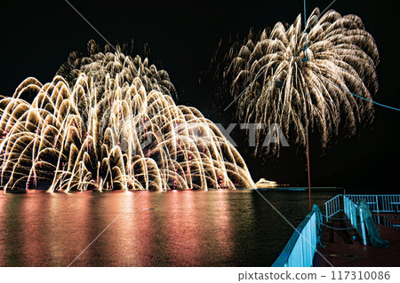 Fireworks reflected in the water Fireworks reflected in the water 117310086