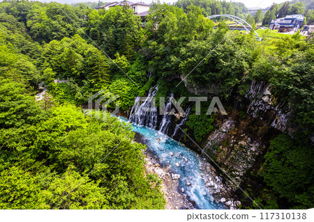 [Hokkaido_Biei_Shirahige Falls] The contrast between the blue and white of the waterfall is striking, at the Blue Pond 117310138