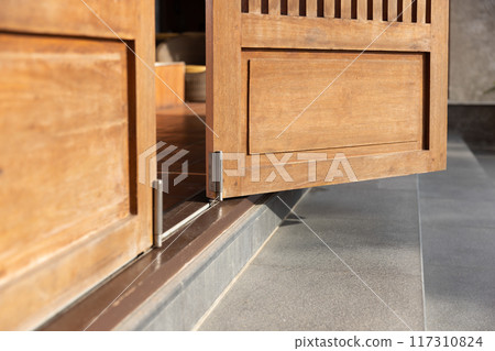 Bottom running bifold system is installed on the floor. 117310824