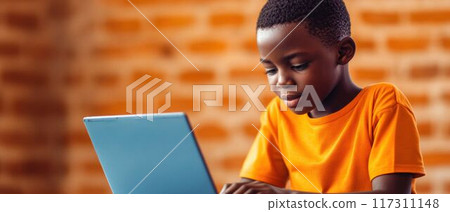 Focused African Boy Learning on a Computer. Focused African Boy Learning on a Computer. 117311148