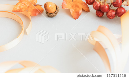 Orange ribbon and autumn plants: Autumn presents and gifts Orange ribbon and autumn plants: Autumn presents and gifts 117311216
