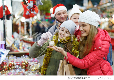 Happy mother and daughter at Christmas fair Happy mother and daughter at Christmas fair 117312079