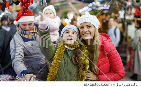 Happy mother and daughter at Christmas fair Happy mother and daughter at Christmas fair 117312133