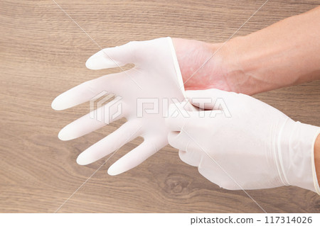 Put on rubber gloves 117314026