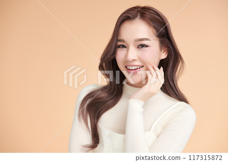 Beautiful young asian woman with clean fresh skin on beige background, Face care, Facial treatment, Cosmetology, beauty and spa, Asian women portrait. Beautiful young asian woman with clean fresh skin on beige background, Face care, Facial treatment, Cosmetology, beauty and spa, Asian women portrait. 117315872