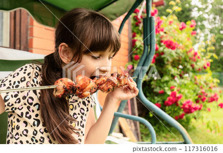 Little girl with shish kebab. Little girl with shish kebab. 117316016