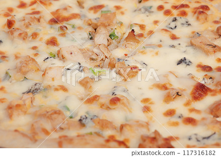 Pizza with chicken and cheese as background macro photo Pizza with chicken and cheese as background macro photo 117316182