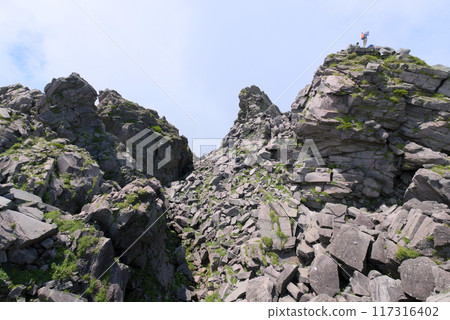 Near the summit of Mt. Chokai's Shinzan mountain, lined with rocky peaks 117316402