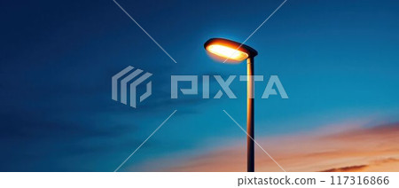Minimalist Street Lamp Illuminated at Night. Minimalist Street Lamp Illuminated at Night. 117316866