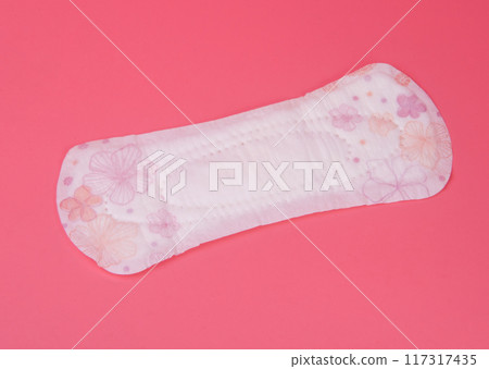 cotton medical towel or pad for women critical days on pink background. Care and protection. cotton medical towel or pad for women critical days on pink background. Care and protection. 117317435