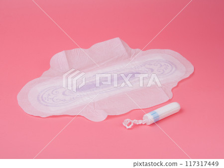 cotton medical towel or pad for women critical days on pink background. Care and protection. cotton medical towel or pad for women critical days on pink background. Care and protection. 117317449