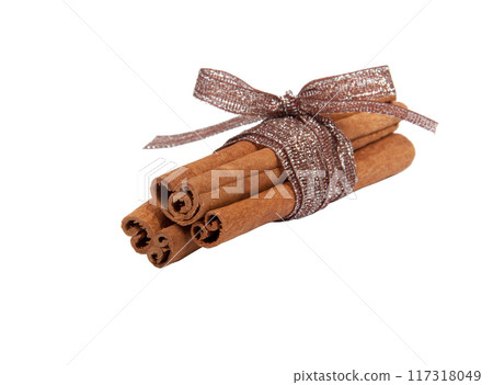 Cinnamon sticks with ribbon isolated on the white Cinnamon sticks with ribbon isolated on the white 117318049
