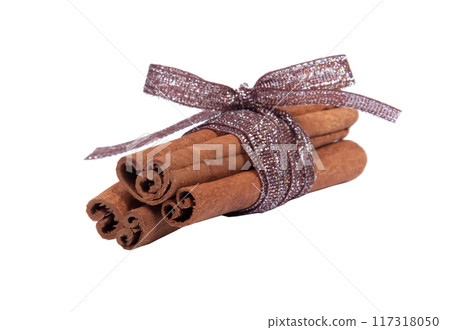 Cinnamon sticks with ribbon isolated on the white 117318050