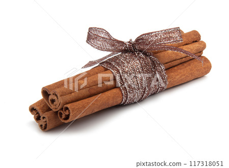 Cinnamon sticks with ribbon isolated on the white Cinnamon sticks with ribbon isolated on the white 117318051