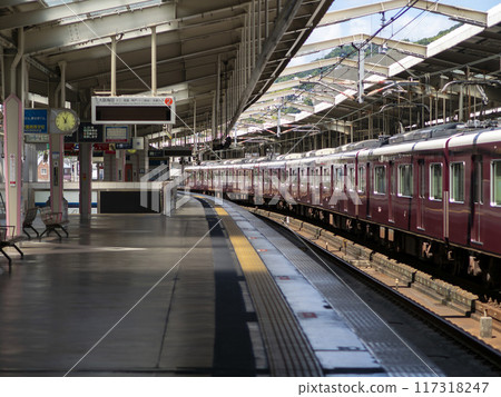 Hankyu train bound for Umeda stops at Kawanishi-Noseguchi Station 117318247