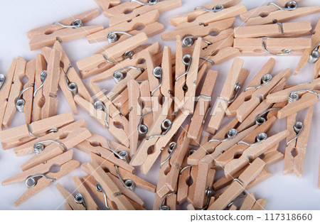wooden clothespin on the white background 117318660
