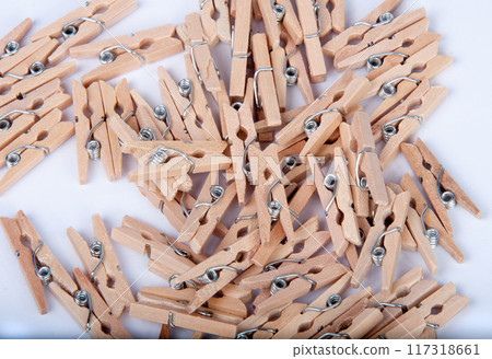 wooden clothespin on the white background wooden clothespin on the white background 117318661