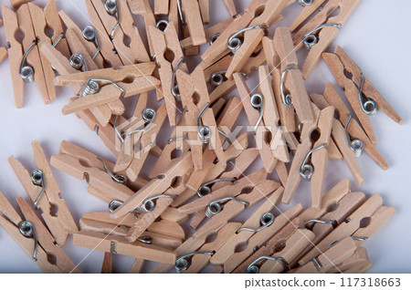 wooden clothespin on the white background wooden clothespin on the white background 117318663