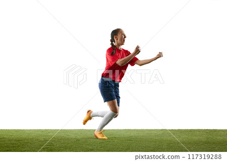 Celebratory moment as female soccer player runs with joy after scoring goal, clenching fists and shouting in triumph on football field. Celebratory moment as female soccer player runs with joy after scoring goal, clenching fists and shouting in triumph on football field. 117319288