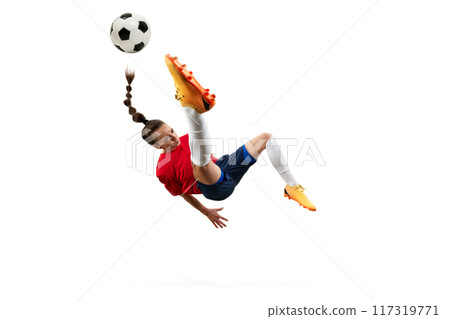 Female soccer player mid-air, executing bicycle kick with precision and power, showcasing athleticism and skill. 117319771
