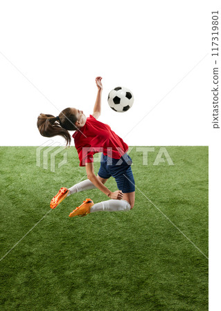 Young athletic woman, football defender wearing comfortable uniform hitting ball with chest in mid air. Movement. 117319801