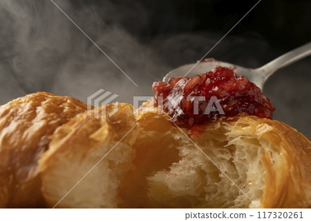 Croissant cross section Spooning jam on top Croissant cross section Spooning jam on top 117320261