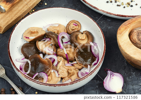 Salted pickled mushrooms. 117321586