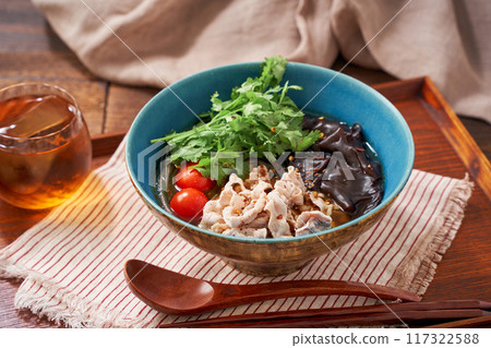 Malatang made with glass noodles topped with pork and wood ear mushrooms 117322588