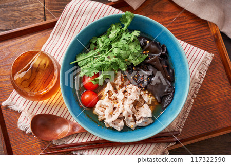 Malatang made with glass noodles topped with pork and wood ear mushrooms Malatang made with glass noodles topped with pork and wood ear mushrooms 117322590
