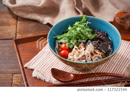 Malatang made with glass noodles topped with pork and wood ear mushrooms Malatang made with glass noodles topped with pork and wood ear mushrooms 117322594