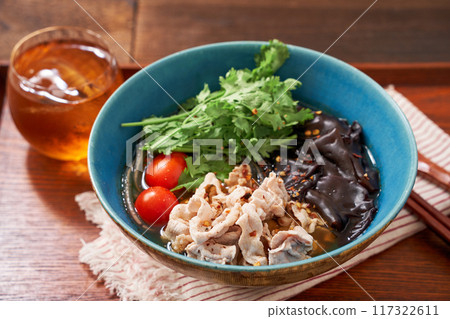 Malatang made with glass noodles topped with pork and wood ear mushrooms 117322611