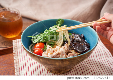 Malatang made with glass noodles topped with pork and wood ear mushrooms Malatang made with glass noodles topped with pork and wood ear mushrooms 117322612