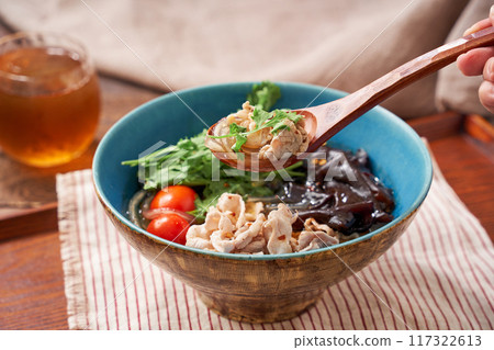 Malatang made with glass noodles topped with pork and wood ear mushrooms 117322613